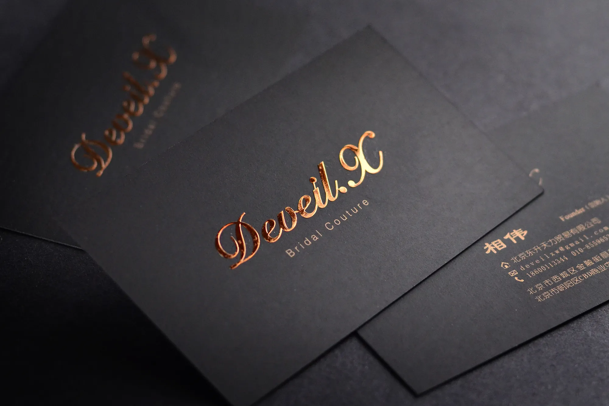 Deep non reflective background contrasting with a structural alloy logo plate designed for exclusive private clubs.