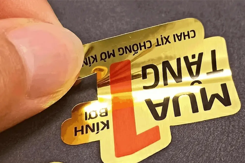 Metallic PET adhesive label showing a visible label film area