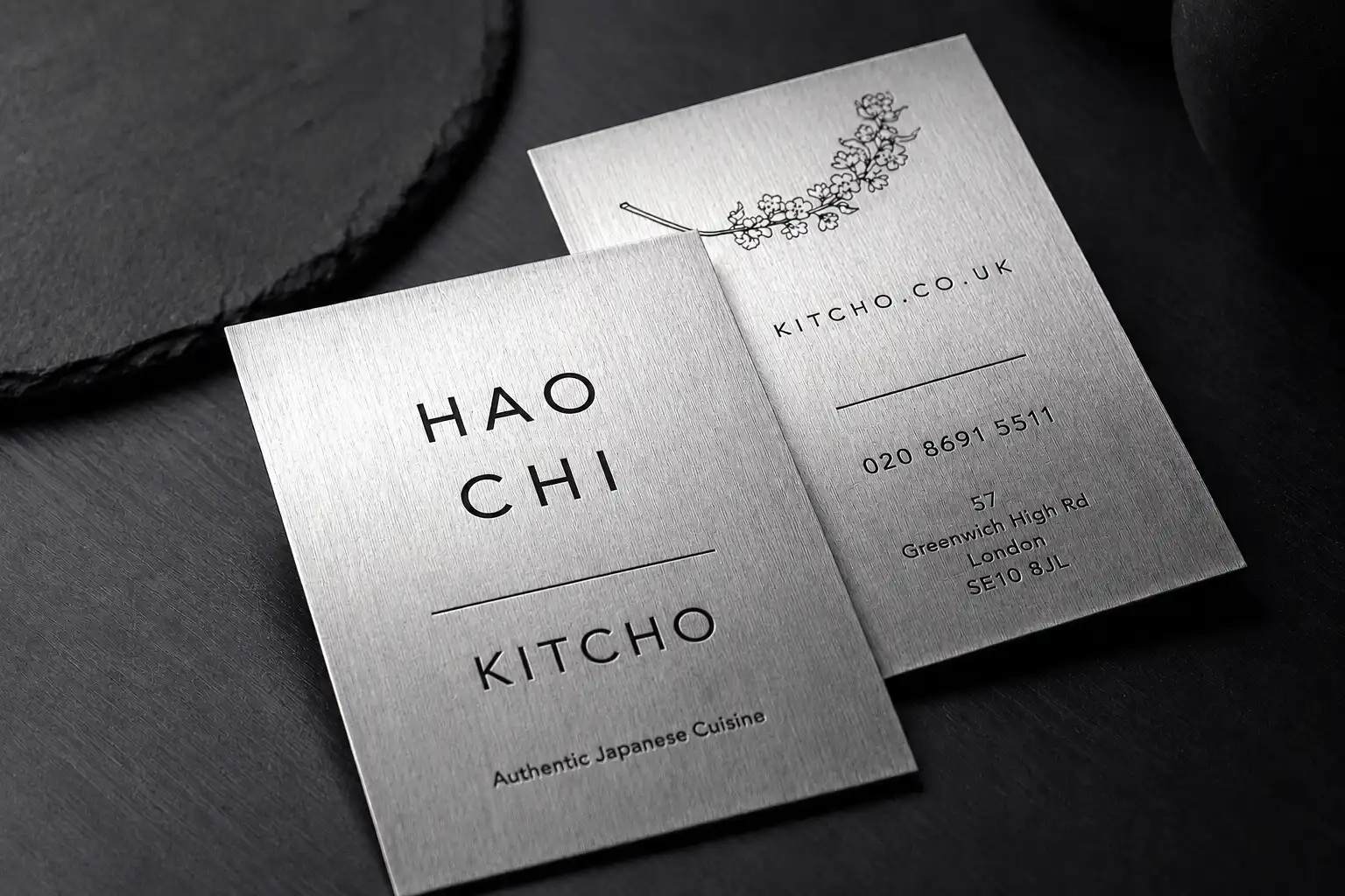 Bright platinum silver metallic paper business cards with black hot foil