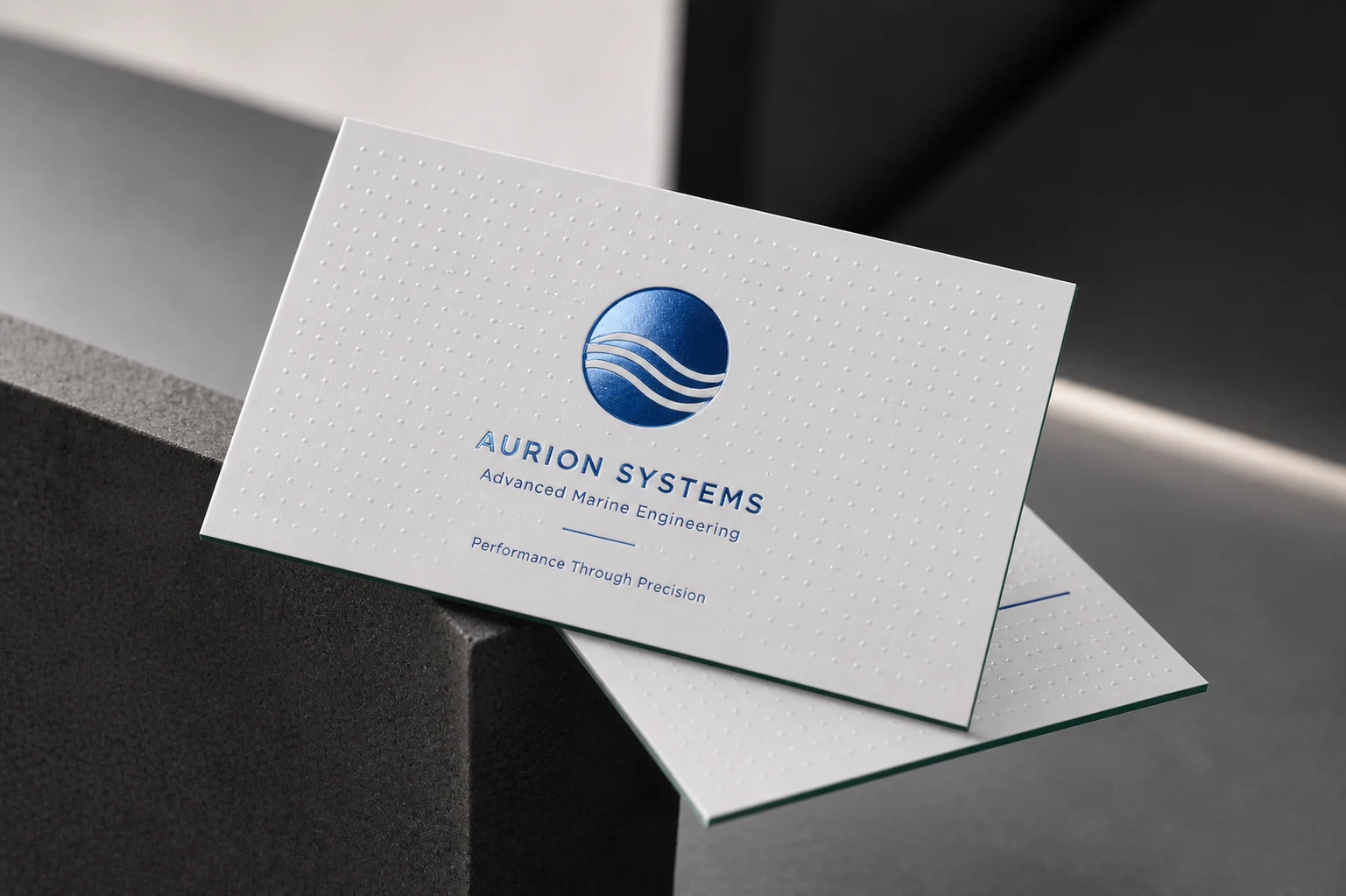Premium 48pt green core tactile business card combining deep debossing with striking blue foil stamping for wealth management firms.