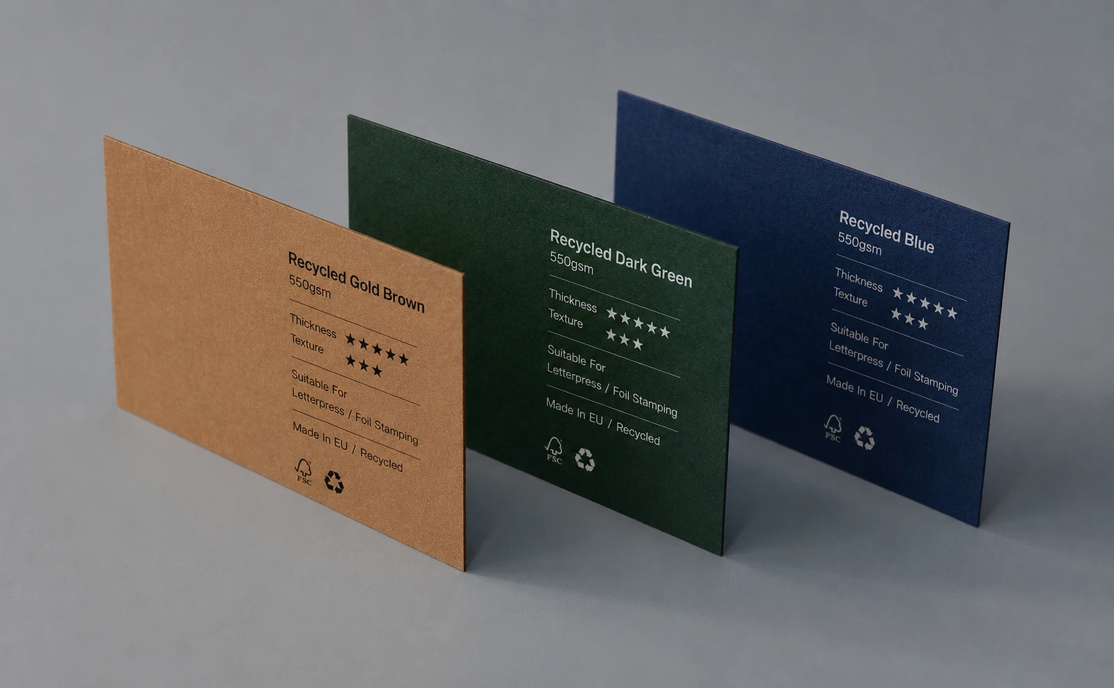 FSC-certified colored eco paper business card options standing on a natural paper desk