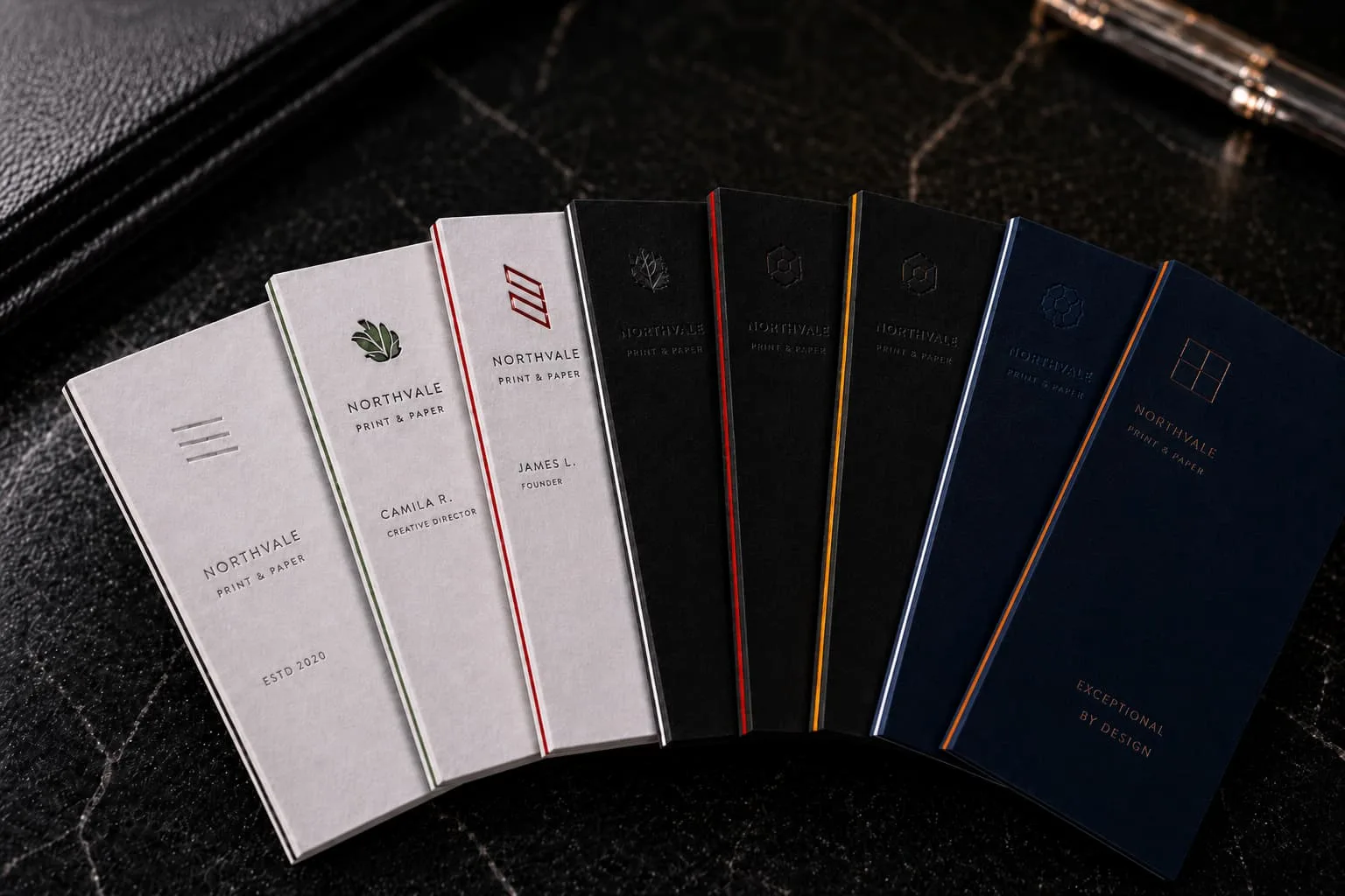 Collection of 8 ultra-thick 48pt triplex business cards showcasing custom colored edges and layered cores, featuring a premium tactile suede finish engineered for elite professionals