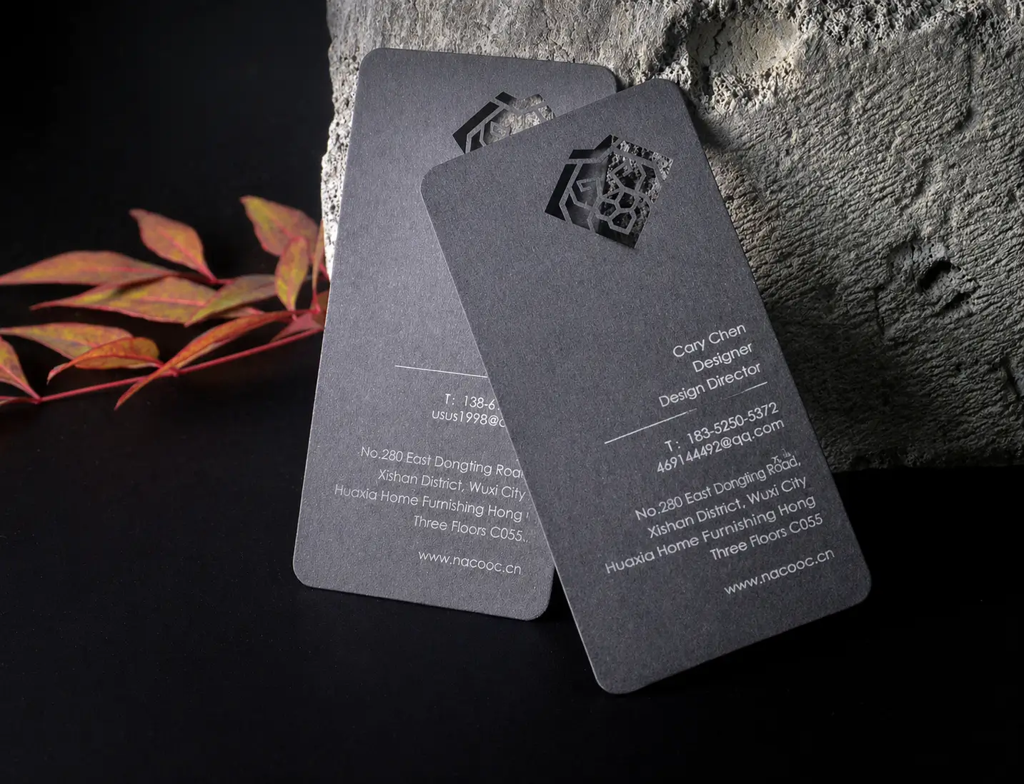 Black business cards with subtle laser engraved logo and fine line detail