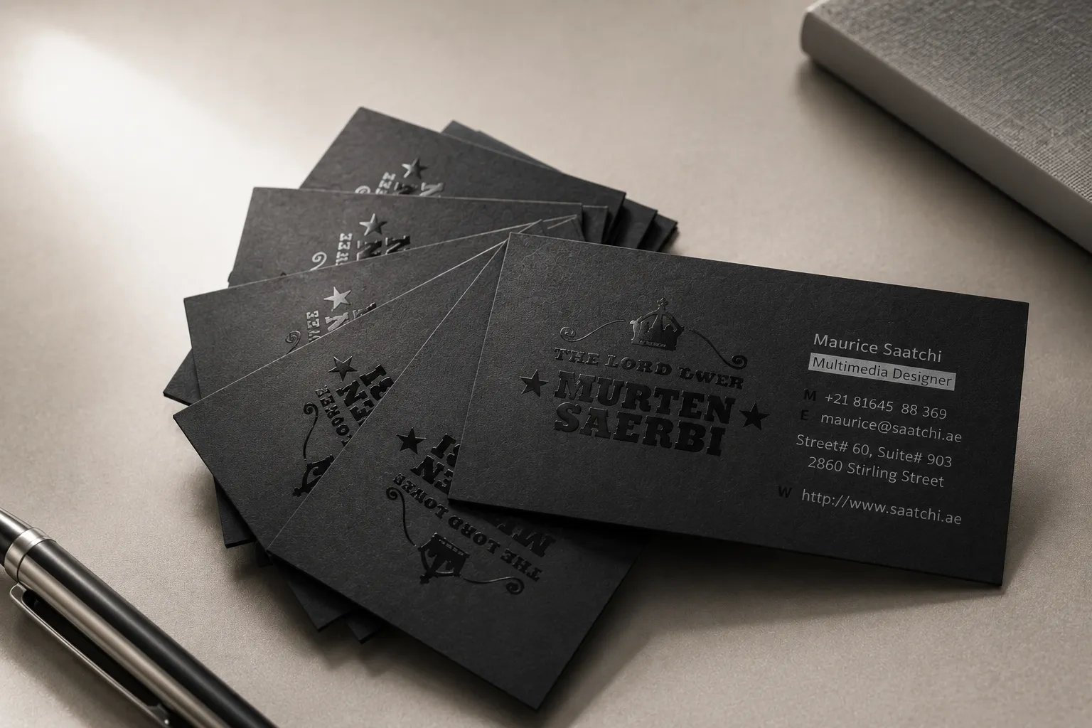 Matte black business cards with clear spot UV pattern and subtle glossy reflections