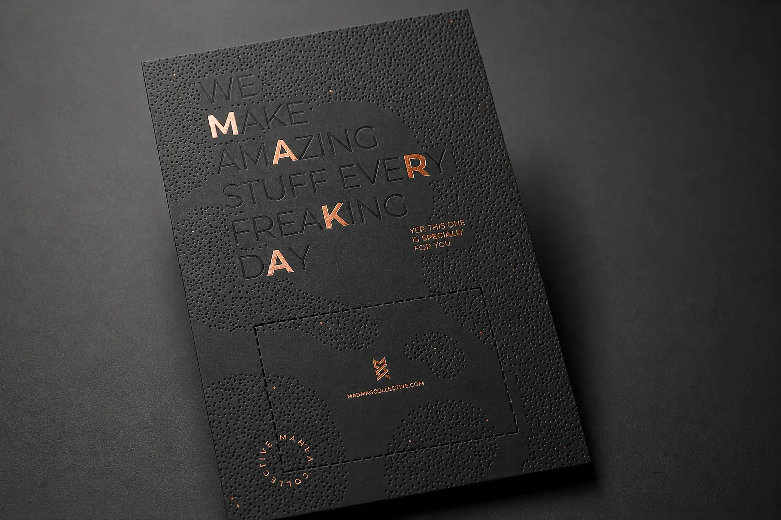 Black business card with experimental typography, low contrast details and small metallic accents.