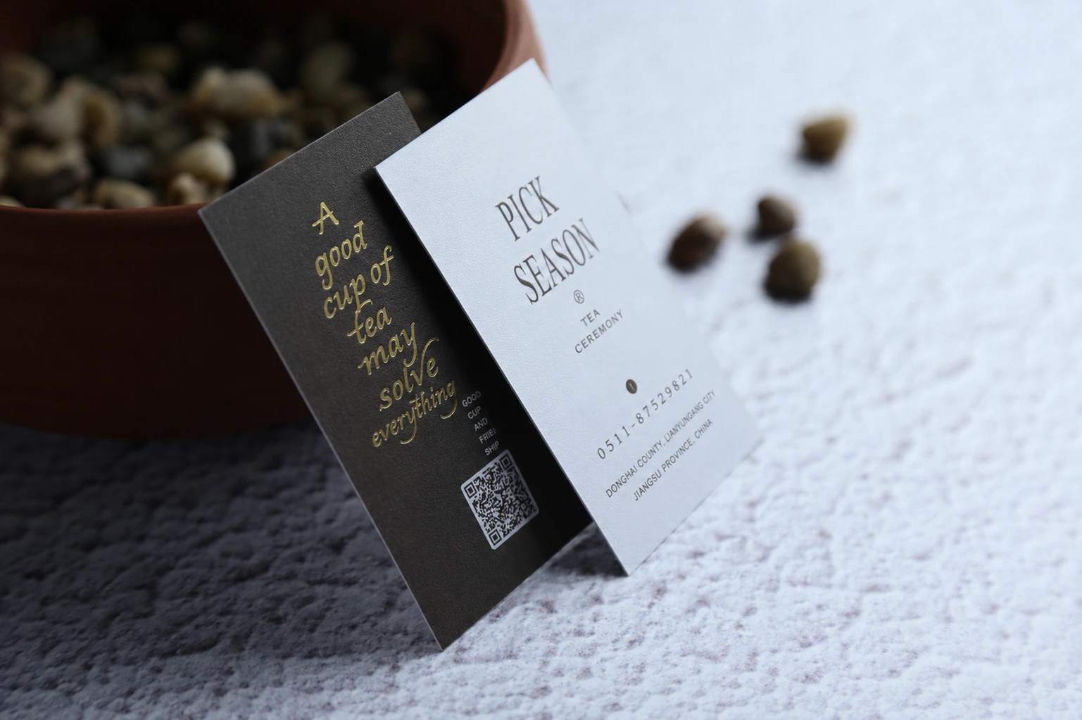 Dark and light fine horizontal ribbed textured paper business cards with subtle one-direction surface lines