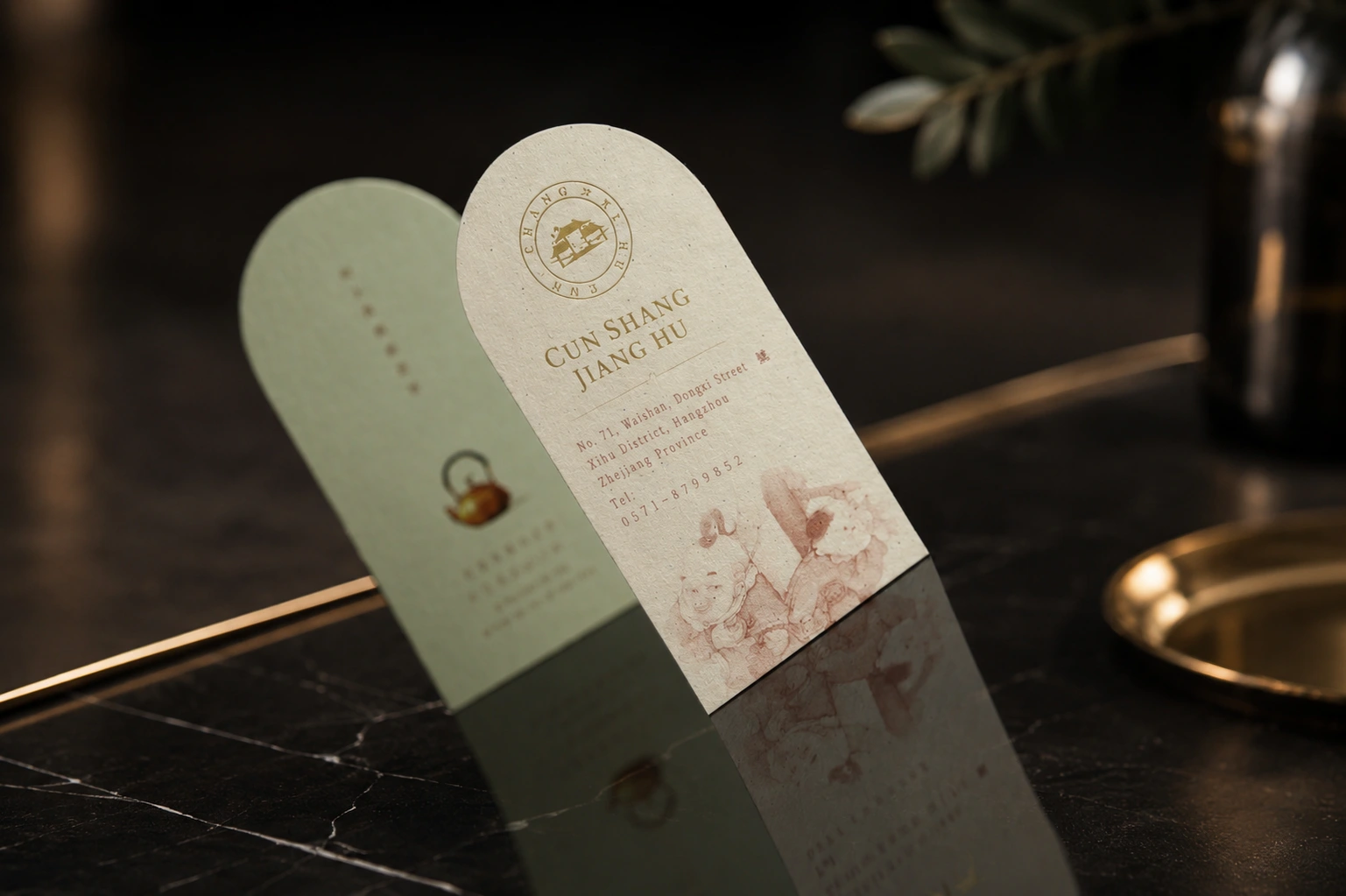 Die cut FSC-certified recycled paper brand cards with natural white and green paper tones