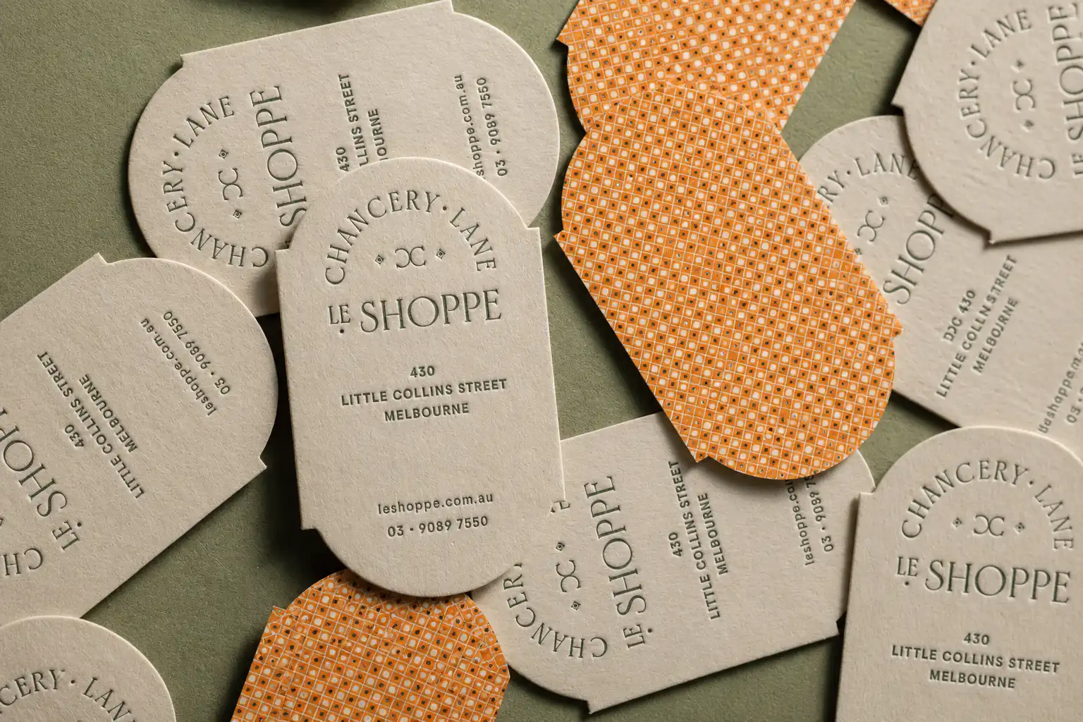 Specialty textured paper duplex business cards with die cut structure