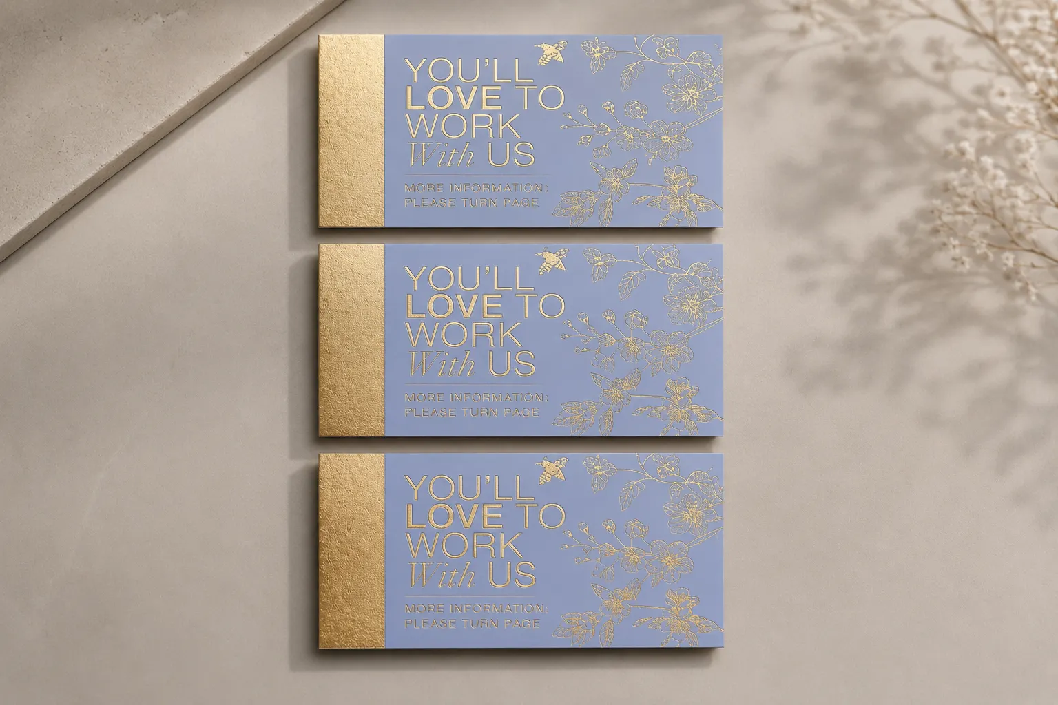 Business card set with subtle foil-style details and blind deboss pattern direction for premium brand presentation.
