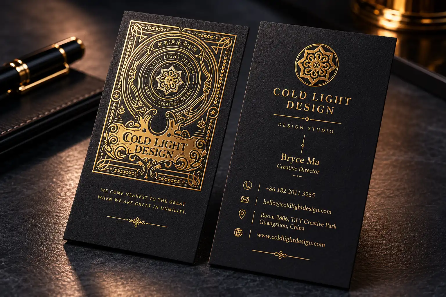 Custom black foil business cards with ornate gold foil artwork