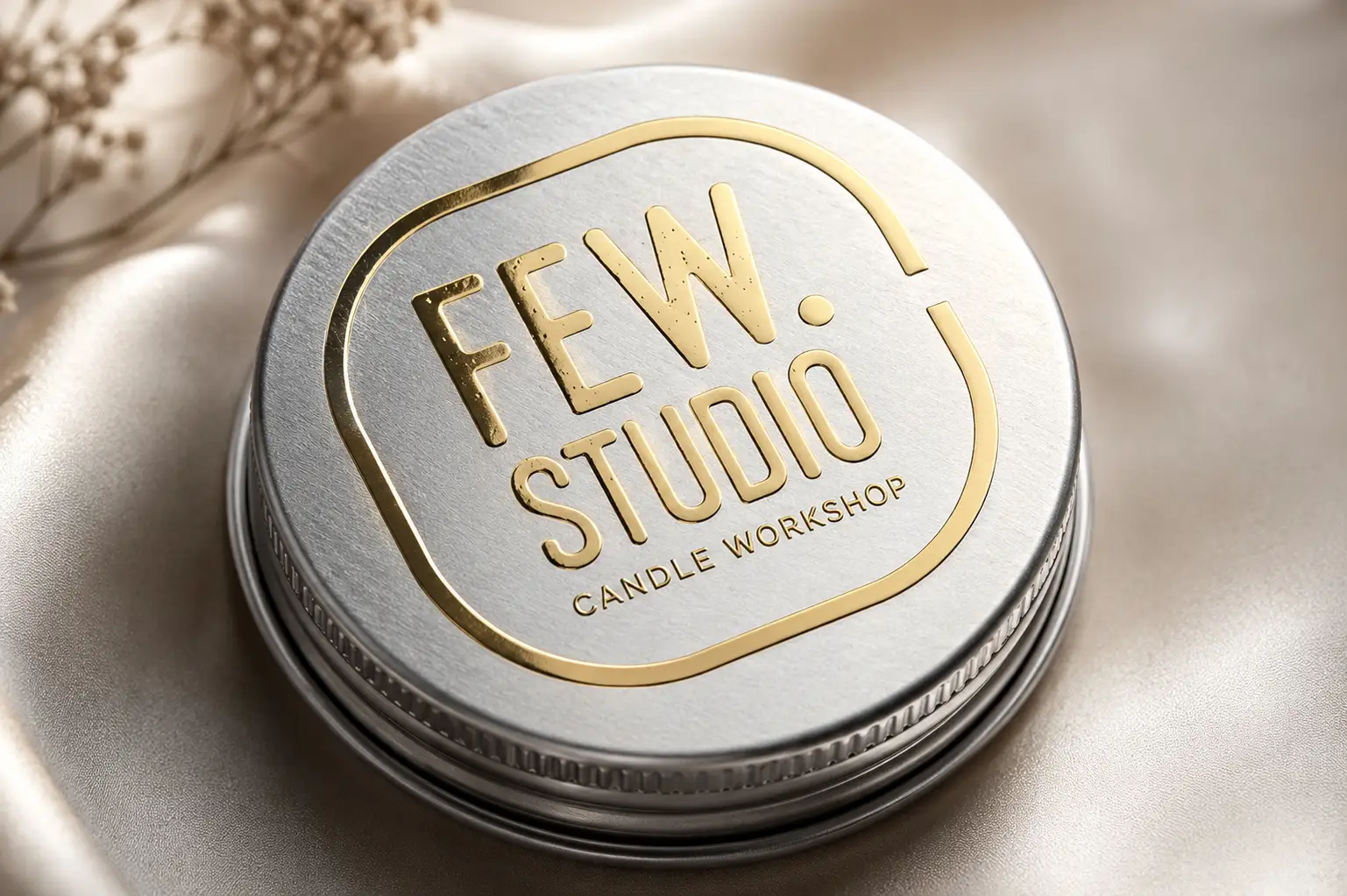 Gold metal transfer decal applied to round silver cosmetic packaging
