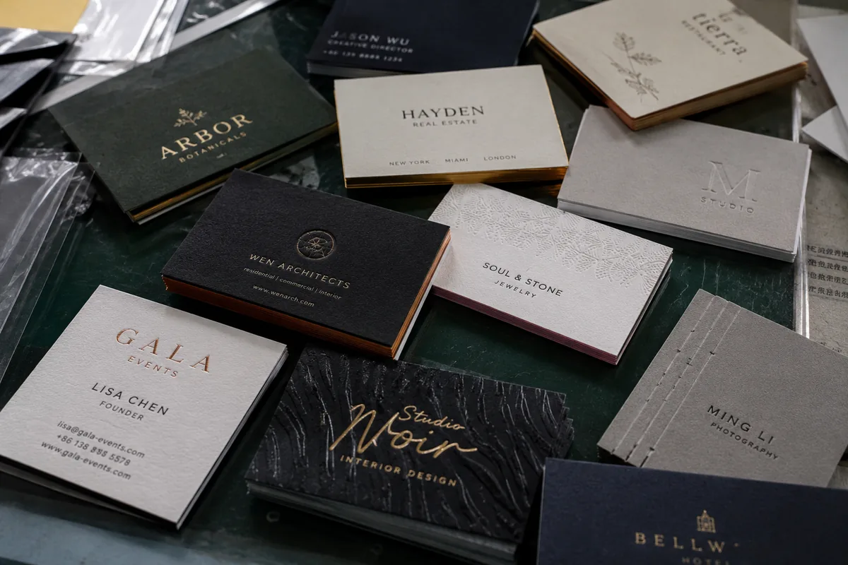 Premium custom business cards with thick stock, soft touch, foil, debossing and edge details
