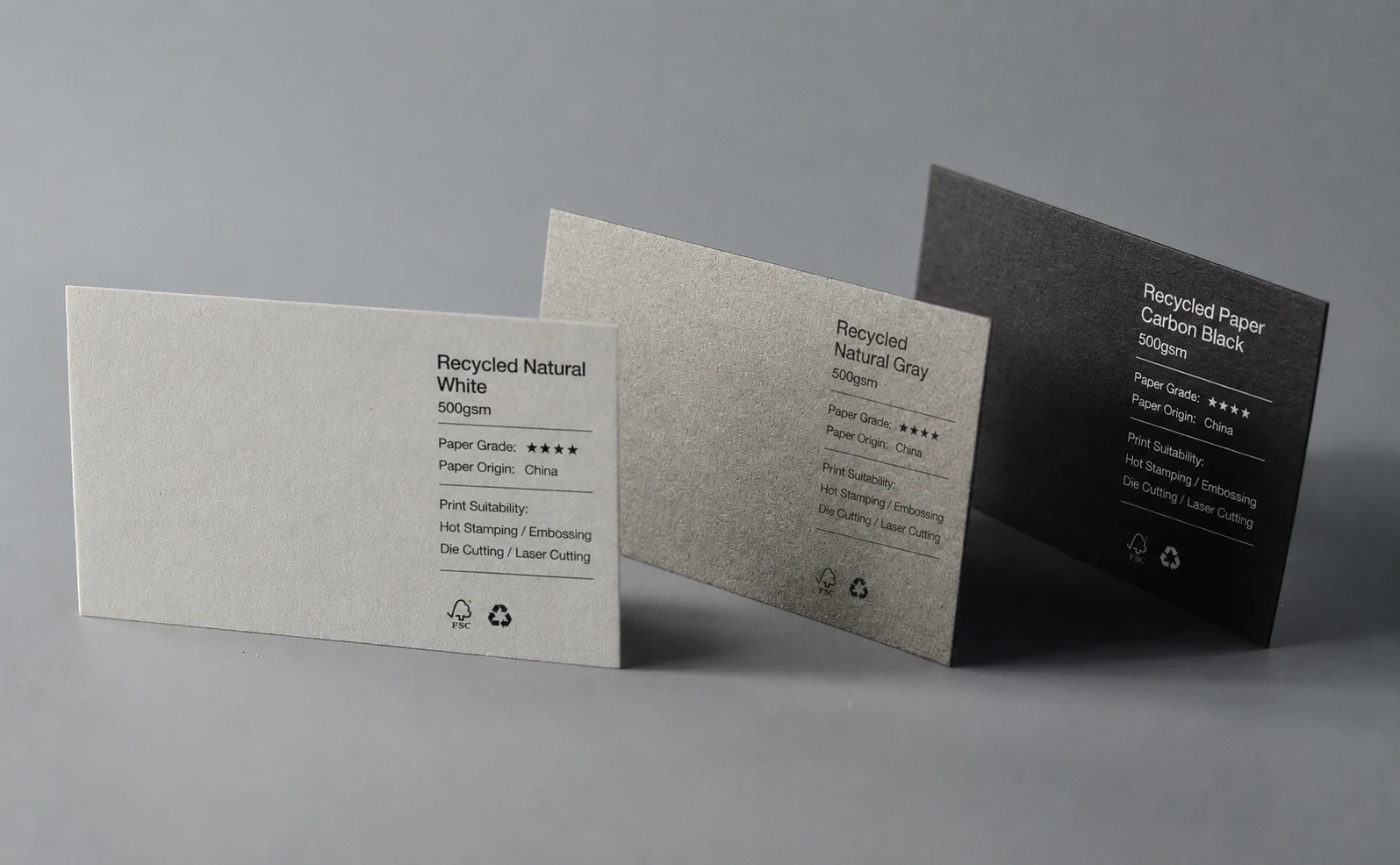 FSC-certified recycled paper business card set showing light, neutral and dark paper color directions