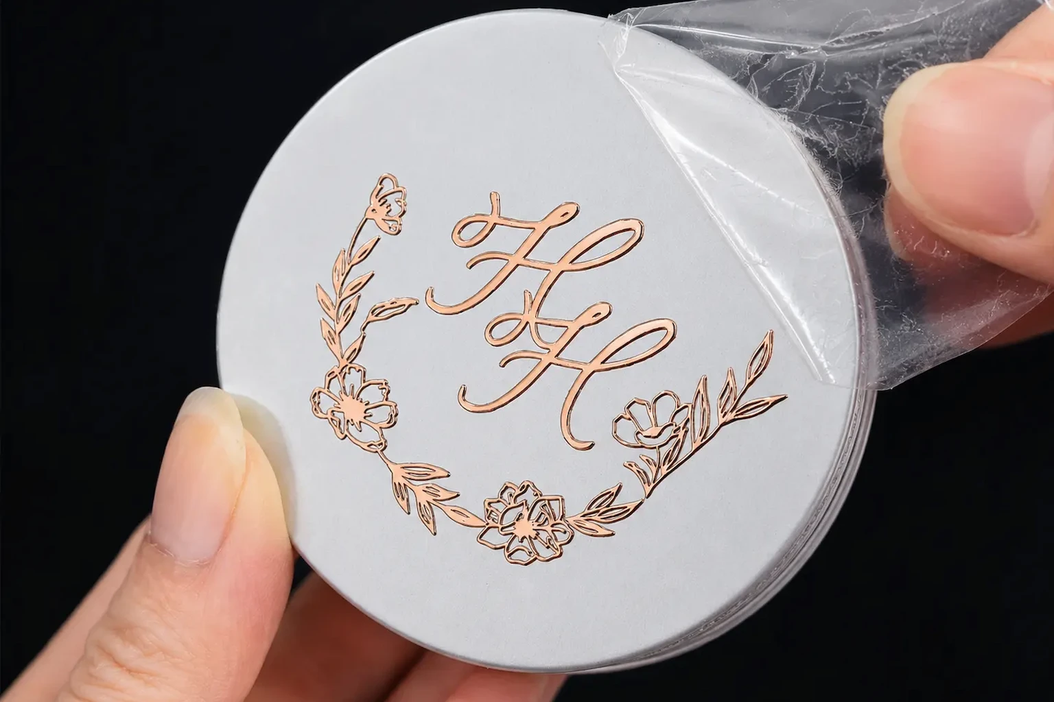 Rose gold metal transfer decal on a round card with clear carrier film
