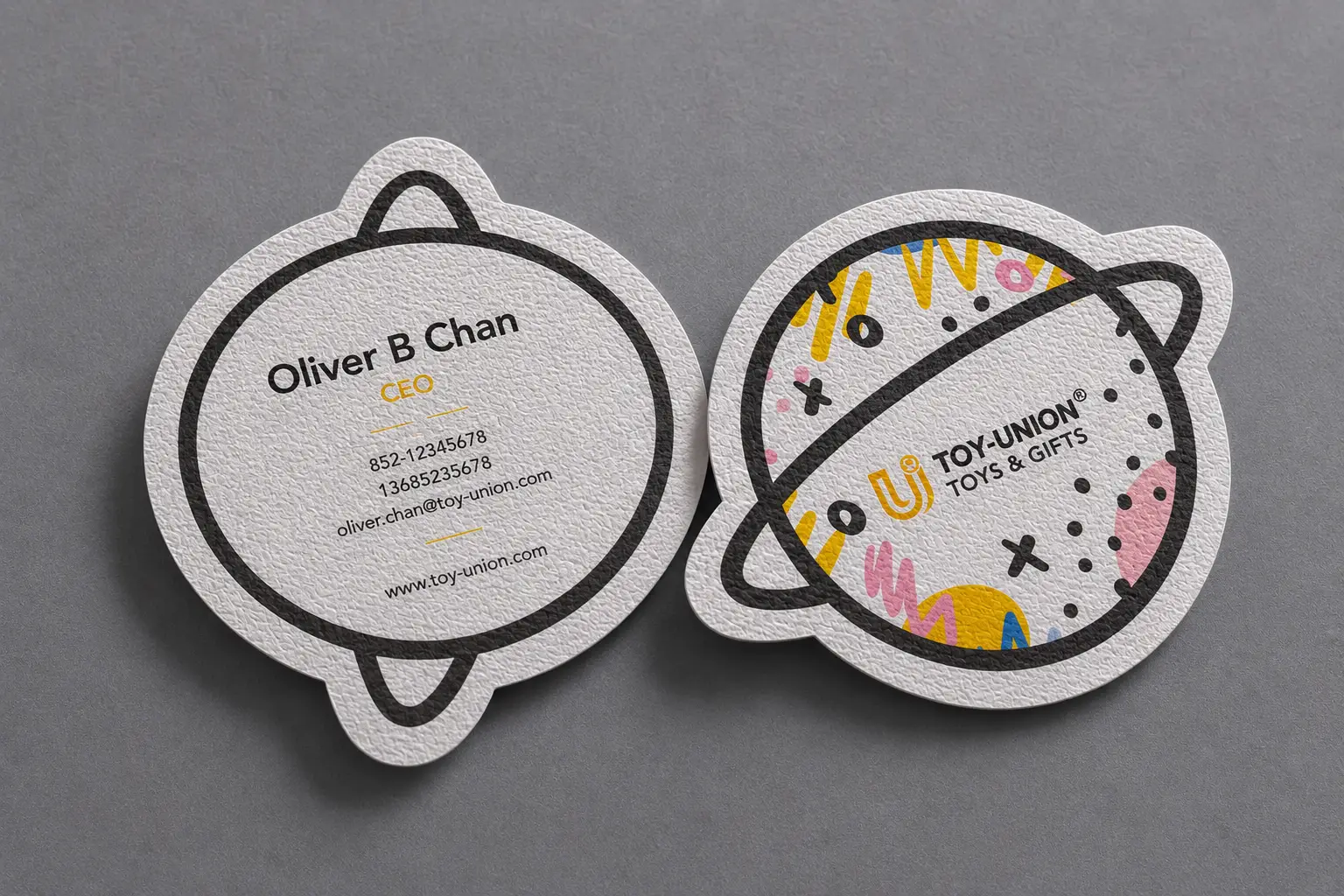 Round die cut textured paper business cards with custom printed layouts and soft uncoated paper texture