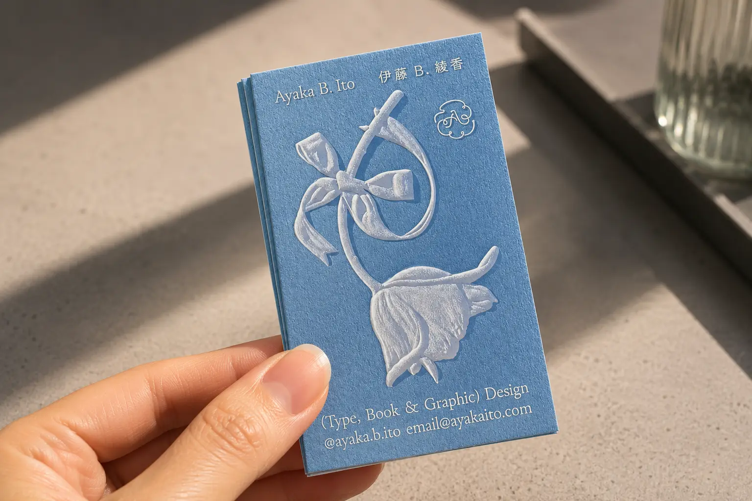 Blind sculpted emboss illustration on premium business card without foil or ink