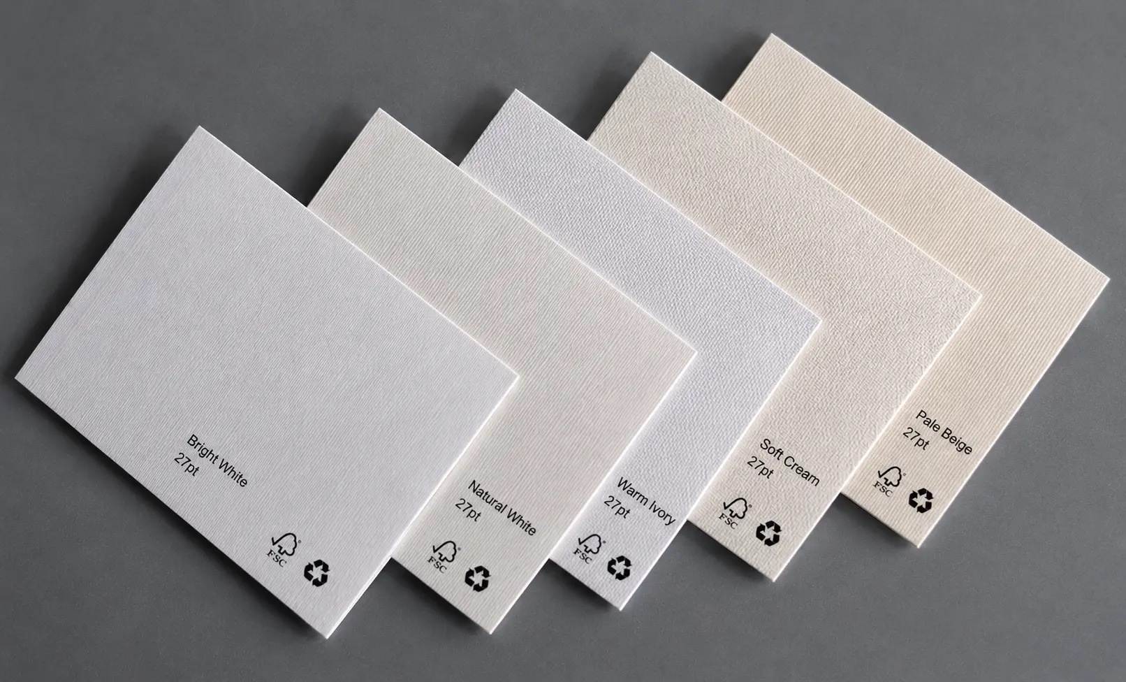 Textured paper swatch cards showing multiple paper textures, stock colors and 27pt thickness labels