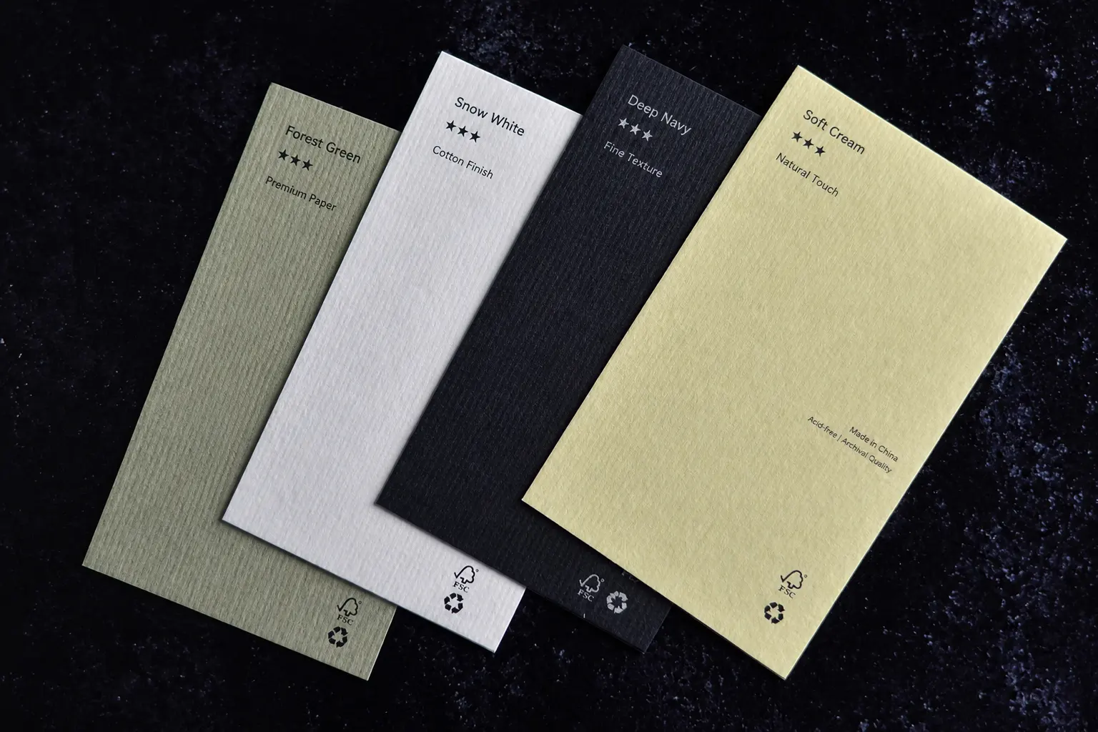 Textured paper color stock sample set showing material colors for business card surface comparison.