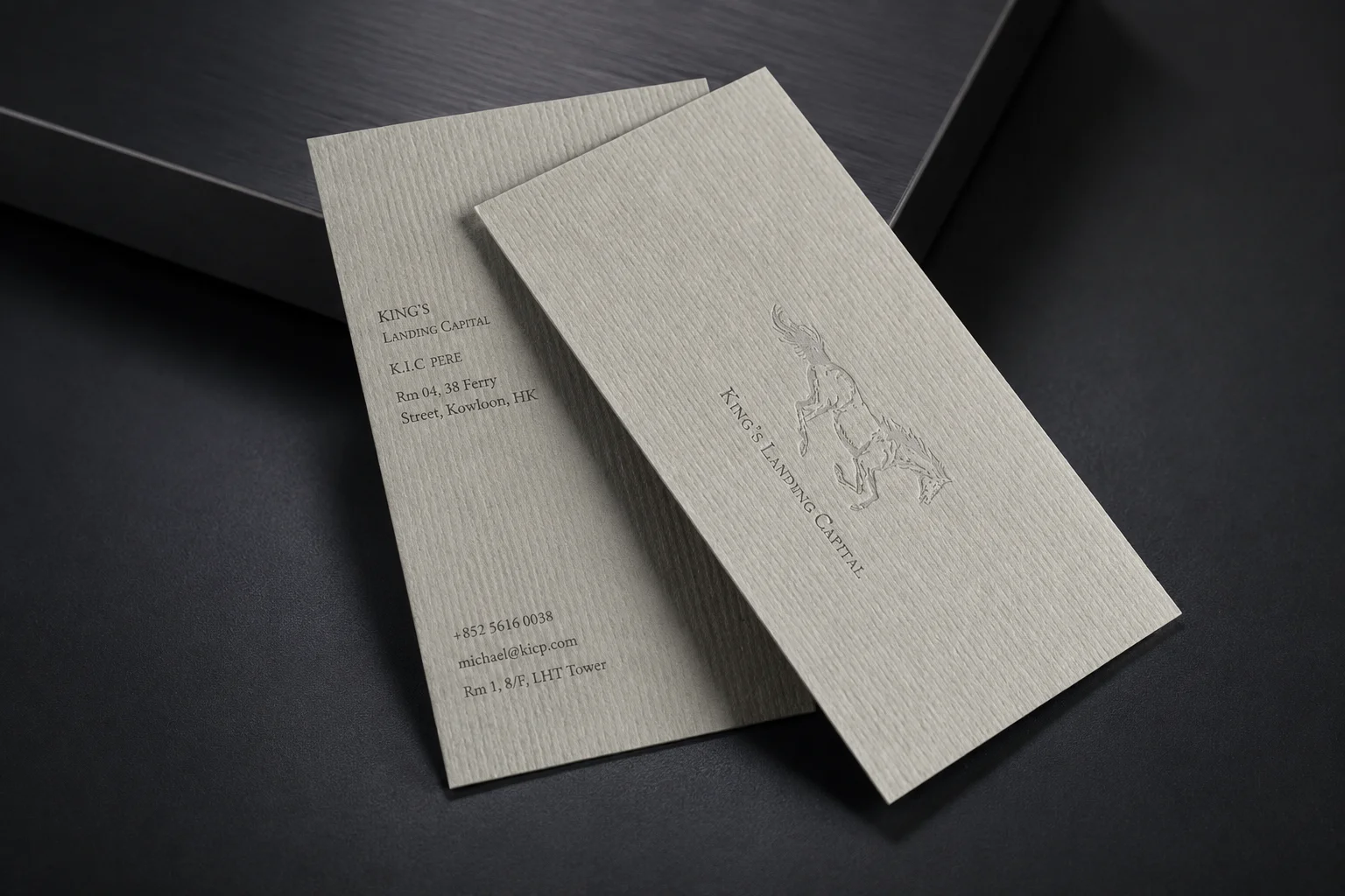 Minimal white fine grain textured paper business card set with restrained printed details